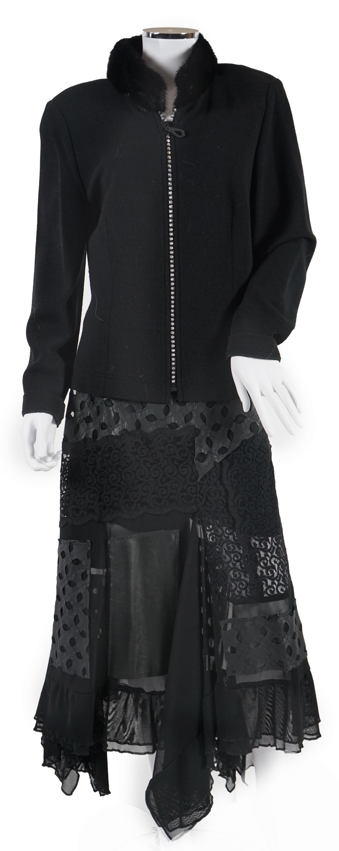 A Gloria Estelles black lady's knitted jacket with fur collar and diamonté detail and an Azur black leather and lace midi skirt. Size 16. Proceeds to Happy Paws Puppy Rescue
